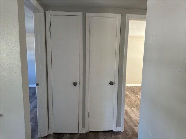 corridor featuring dark hardwood / wood-style flooring