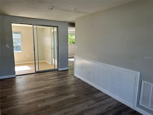 unfurnished room featuring dark hardwood / wood-style floors