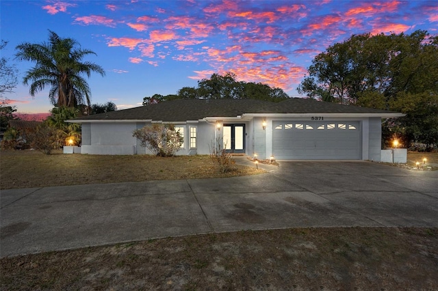 ranch-style house featuring a garage