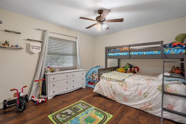 bedroom featuring dark wood-type flooring and ceiling fan