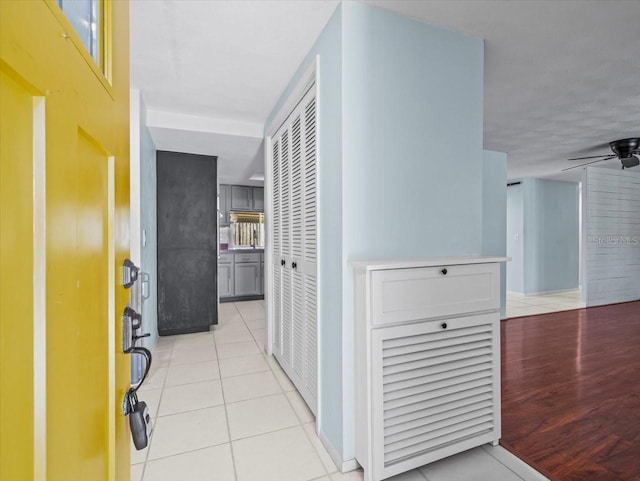 hallway featuring light tile patterned floors