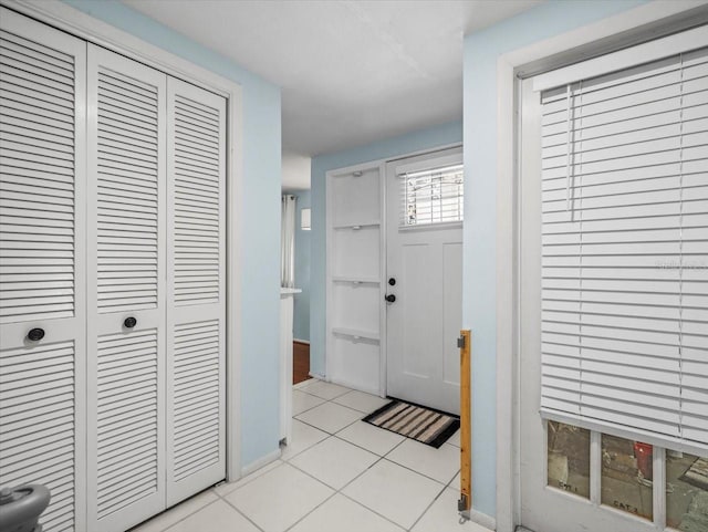 entryway featuring light tile patterned flooring