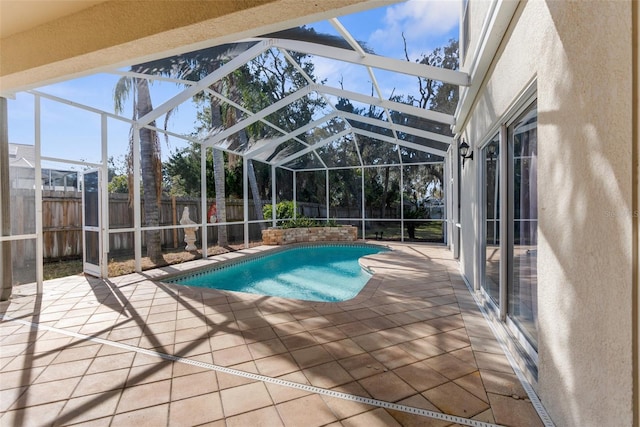 view of pool featuring a lanai and a patio area