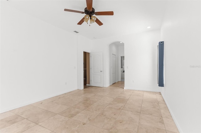 empty room featuring light tile patterned floors and ceiling fan