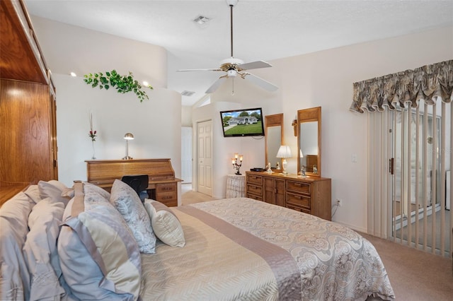 bedroom featuring lofted ceiling, light colored carpet, and ceiling fan