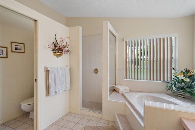 bathroom featuring tile patterned flooring, separate shower and tub, a textured ceiling, and toilet