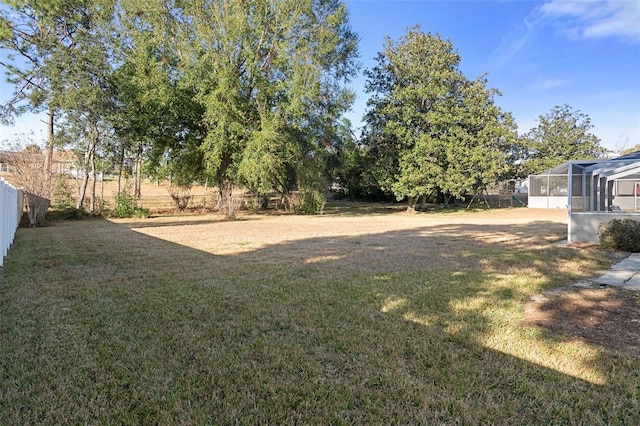 view of yard with a lanai