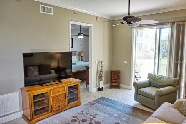 tiled living room with ornamental molding and ceiling fan