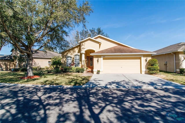 view of front of home featuring a garage and a front yard