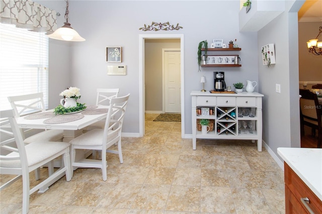 dining area featuring an inviting chandelier