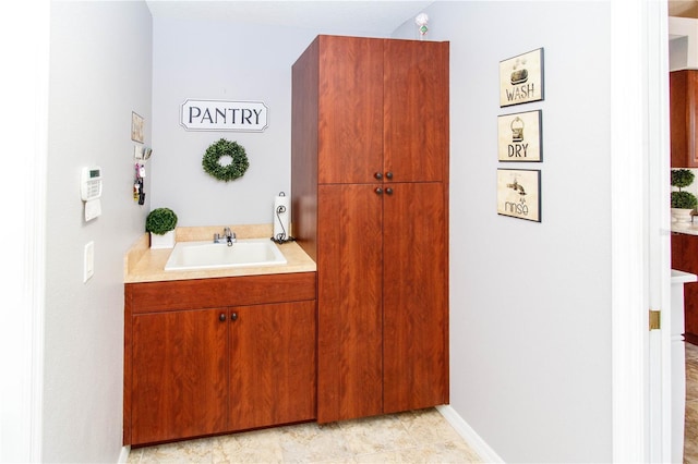 bathroom featuring tile patterned flooring and sink