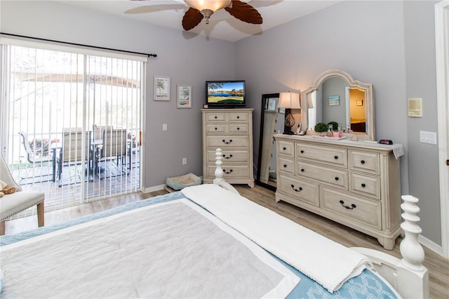 bedroom featuring access to outside, ceiling fan, and light wood-type flooring