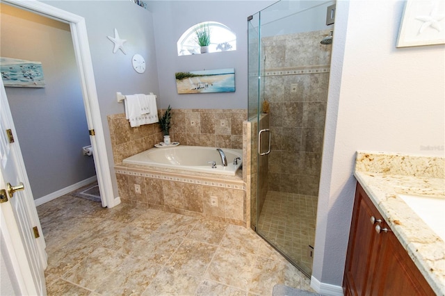 bathroom with vanity and plus walk in shower