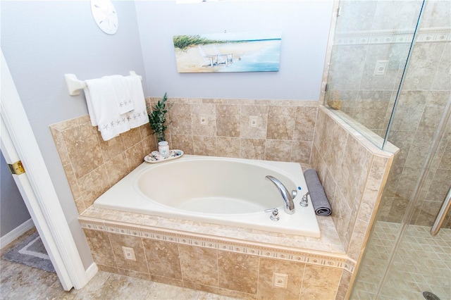 bathroom with shower with separate bathtub and tile patterned floors