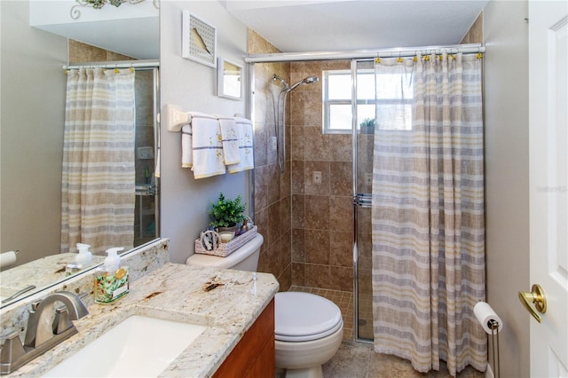 bathroom featuring vanity, toilet, and a shower with shower curtain