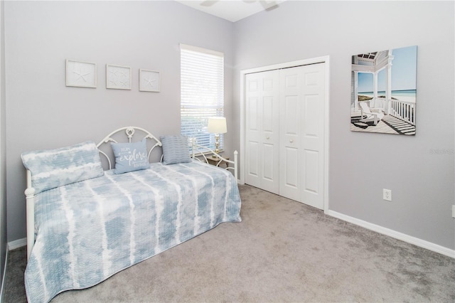 carpeted bedroom with a closet