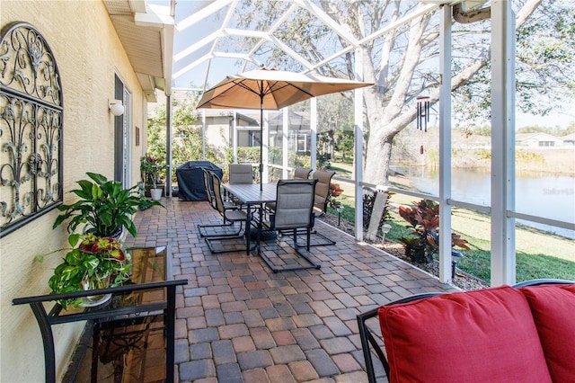 sunroom / solarium with a water view