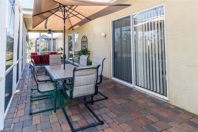 view of patio with ceiling fan and an outdoor hangout area