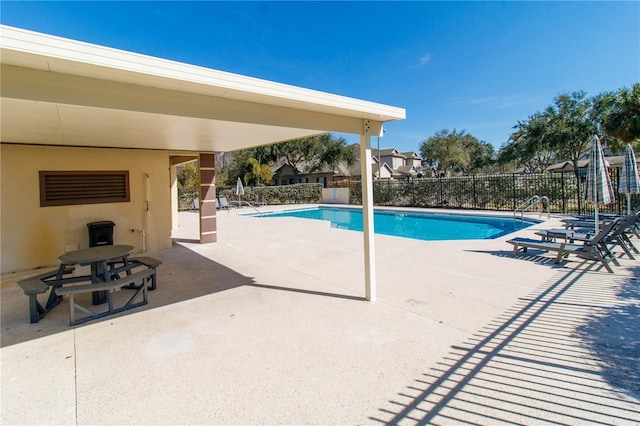 view of swimming pool featuring a patio area