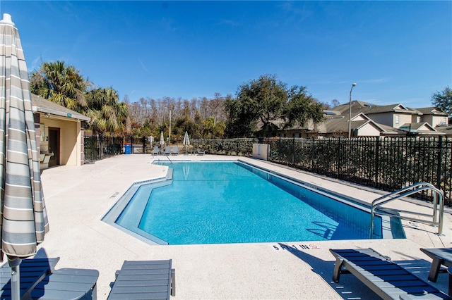 view of swimming pool featuring a patio area