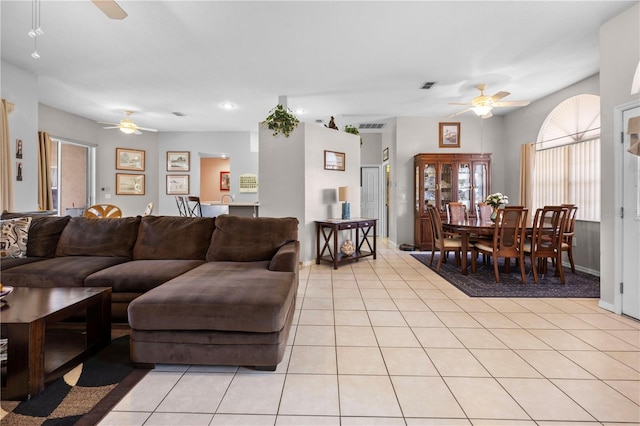 living room featuring light tile patterned flooring and ceiling fan