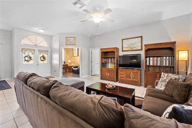 living room with light tile patterned flooring and ceiling fan