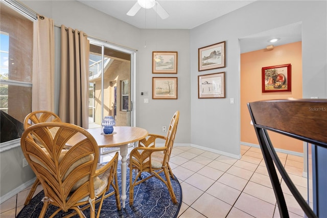 dining room featuring light tile patterned flooring and ceiling fan