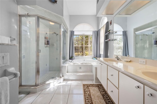 bathroom featuring tile patterned floors, independent shower and bath, and vanity