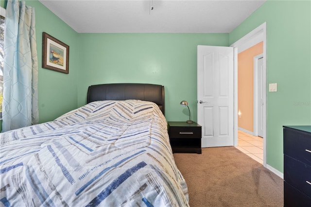 bedroom with light colored carpet