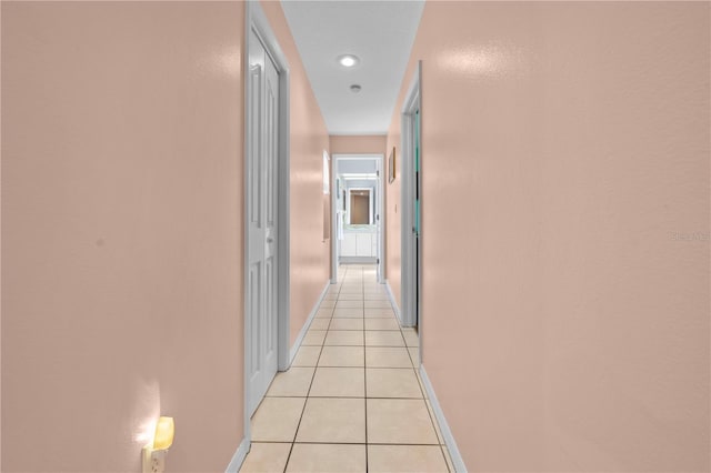 hallway with light tile patterned flooring