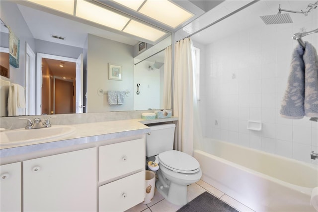 full bathroom with vanity, shower / tub combo, tile patterned floors, and toilet