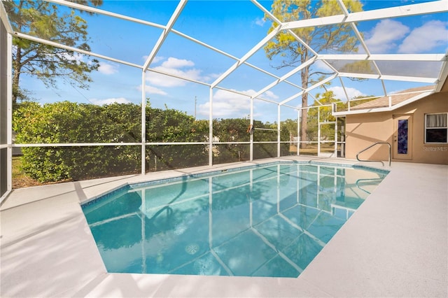 view of pool featuring a lanai and a patio area