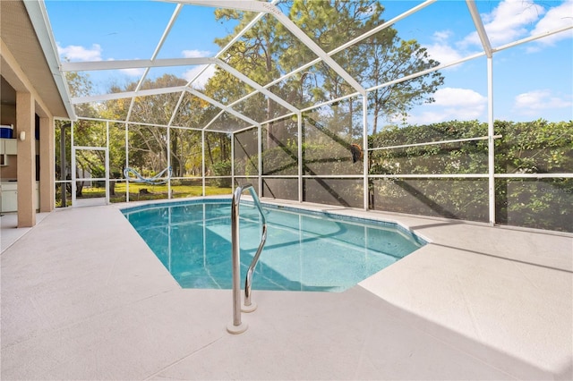 view of pool with a lanai and a patio area