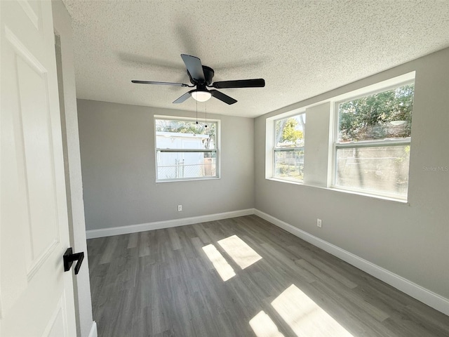 unfurnished room with wood-type flooring, ceiling fan, and a textured ceiling