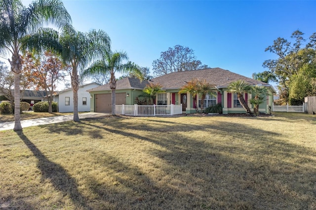 ranch-style home featuring a garage and a front yard