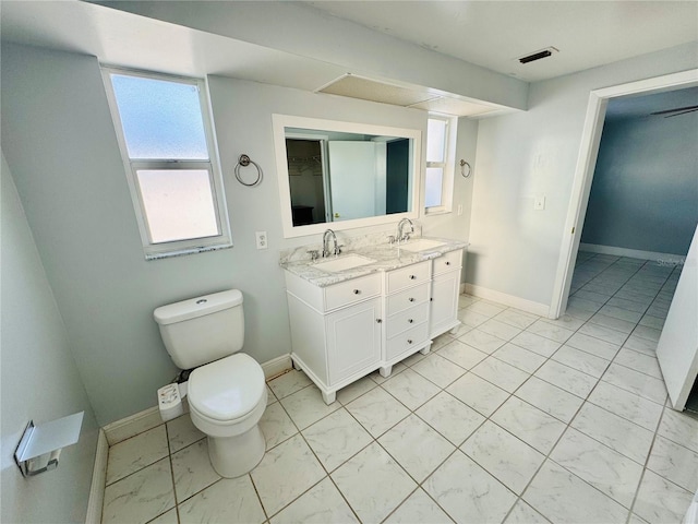 bathroom featuring vanity and toilet