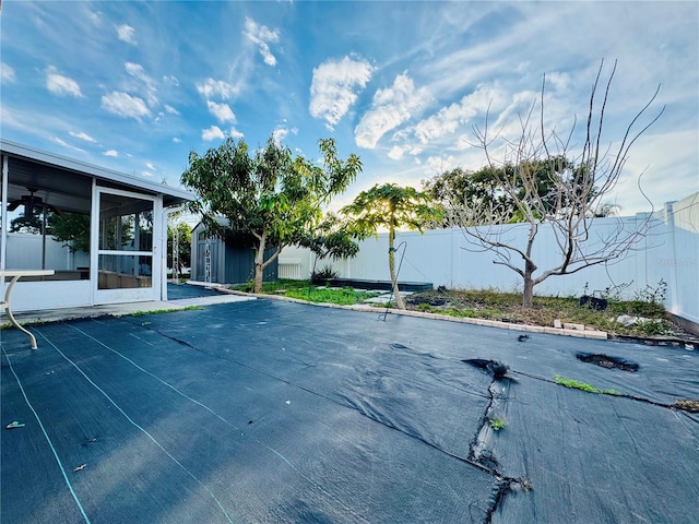 view of pool with a sunroom