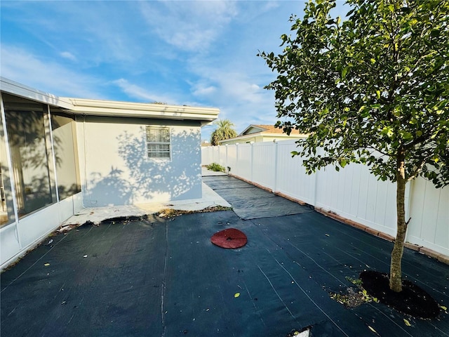 view of property exterior with a patio