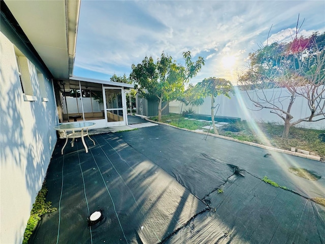 view of pool featuring a sunroom