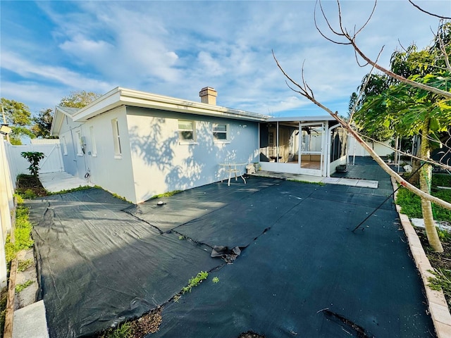 rear view of house featuring a patio