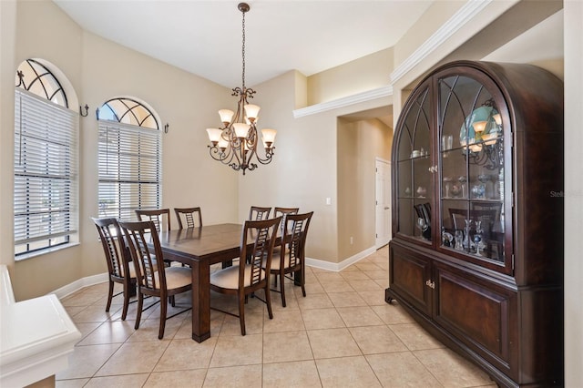 dining room with a healthy amount of sunlight, a chandelier, and light tile patterned floors