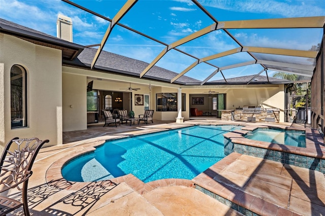 view of swimming pool featuring a patio area, glass enclosure, and an in ground hot tub