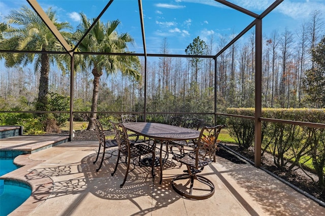 view of patio with glass enclosure