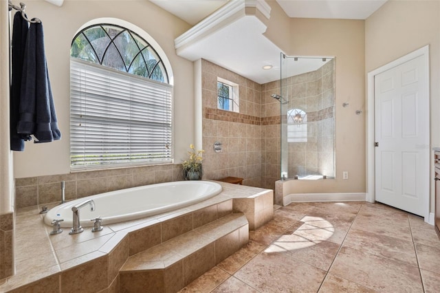 bathroom with tile patterned flooring, plenty of natural light, and independent shower and bath