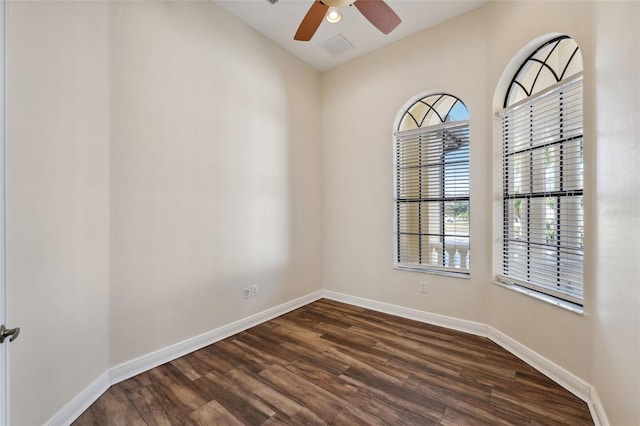 spare room featuring ceiling fan and dark hardwood / wood-style flooring