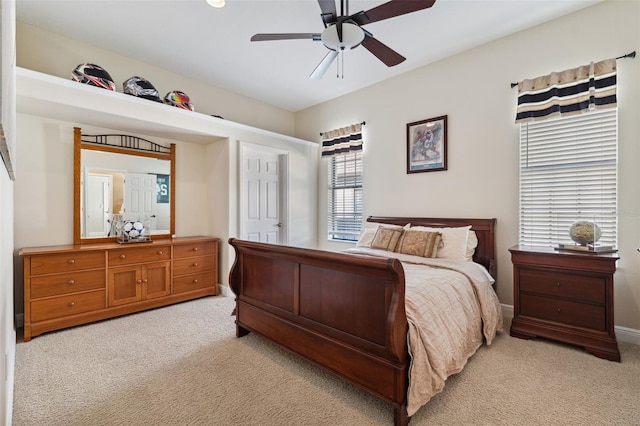 carpeted bedroom with ceiling fan