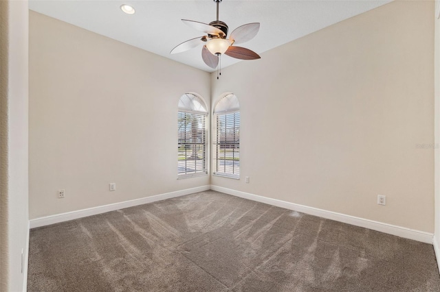 empty room with carpet floors and ceiling fan