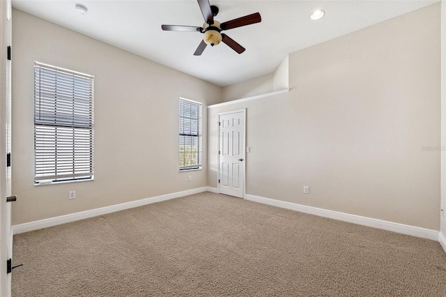 carpeted empty room with ceiling fan