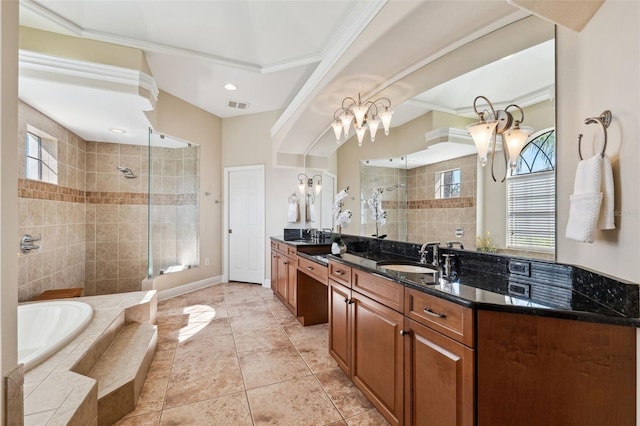 bathroom featuring vanity, shower with separate bathtub, and a wealth of natural light