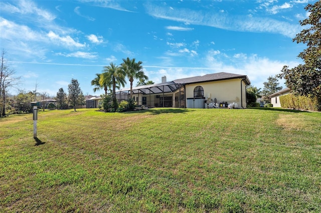 view of yard with a lanai